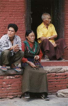 Tibetan family on step. Photo © Lisa Daix Tibetan family on step. Photo © Lisa Daix