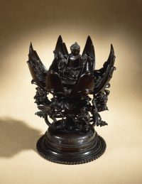 A lotus mandala cast in bronze, with a figure of Aksobhya.