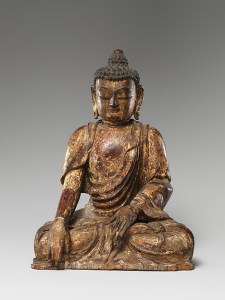 The Buddha is shown in the attitude of preaching with one finger of the right hand extended to call the earth to witness and the left hand in the abhaya mudra. A removable panel in the back reveals a cavity that contained a group of silks symbolizing the five vital organs together with seeds, sym-bolic objects, and prayers, one of which carried a date corresponding to May 9, 1411. © The Metropolitan Museum of Art