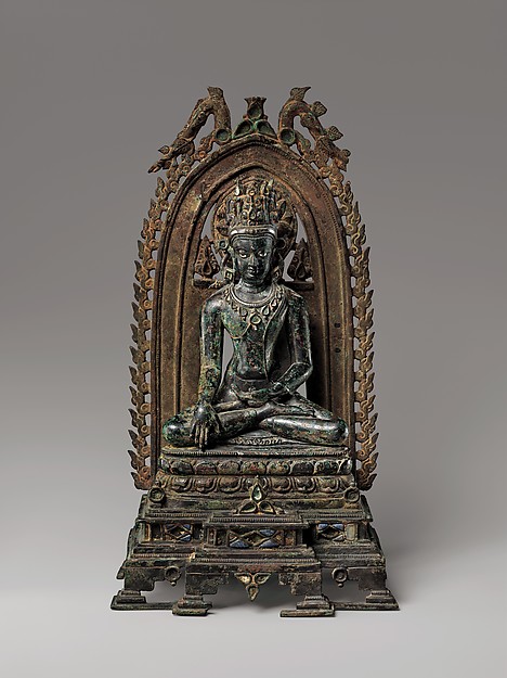 Crowned Buddha. India, Bihar, 10th–11th century. Bronze inlaid with silver, lapis lazuli, and rock crystal. © The Metropolitan Museum of Art