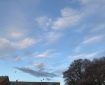 Sky over Totnes with moon, birds, and clouds.