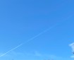 Plane vapour across the sky.