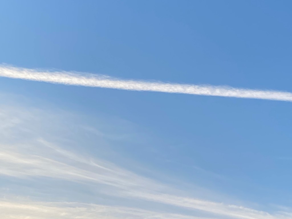 A splash of cloud in a blue sky.