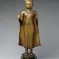 Standing Crowned Buddha gesturing protection.