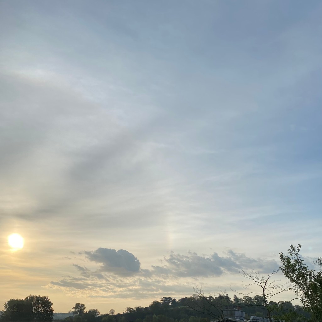 Early Sun, with some fancy clouds.