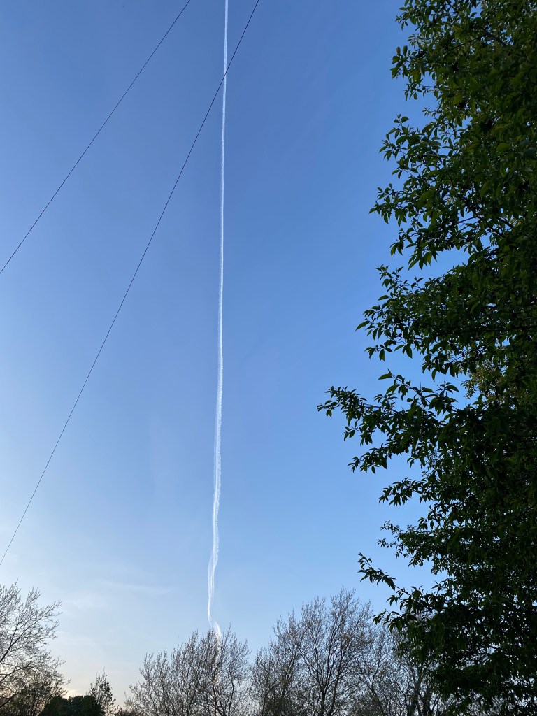 Jet vapour in a blue sky.
