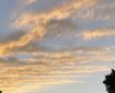 Layers of clouds in the sunset. Morning Meditation: May all beings realise the freedom of contentment.
